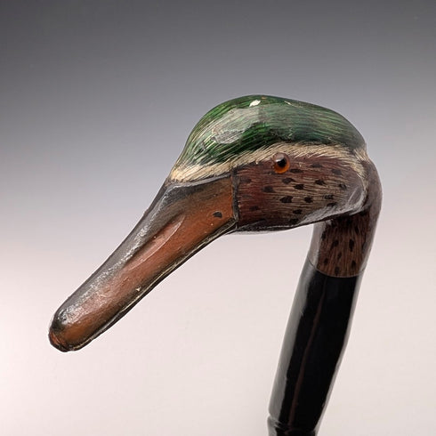 British vintage twisted black shaft walking stick with painted duckhead handle, 94cm